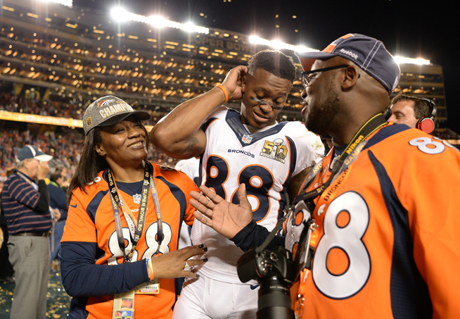 Demaryius Thomas (88) of the Denver Broncos leaves the field with his mom, Katina Smith, and dad, Bobby Thomas, after the game. The Denver Broncos played the Carolina Panthers in Super Bowl 50 at Levi's Stadium in Santa Clara, Calif. on Feb. 7, 2016. (AAron Ontiveroz, The Denver Post)