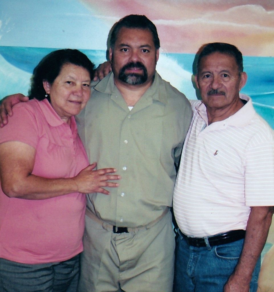 With his parents 
